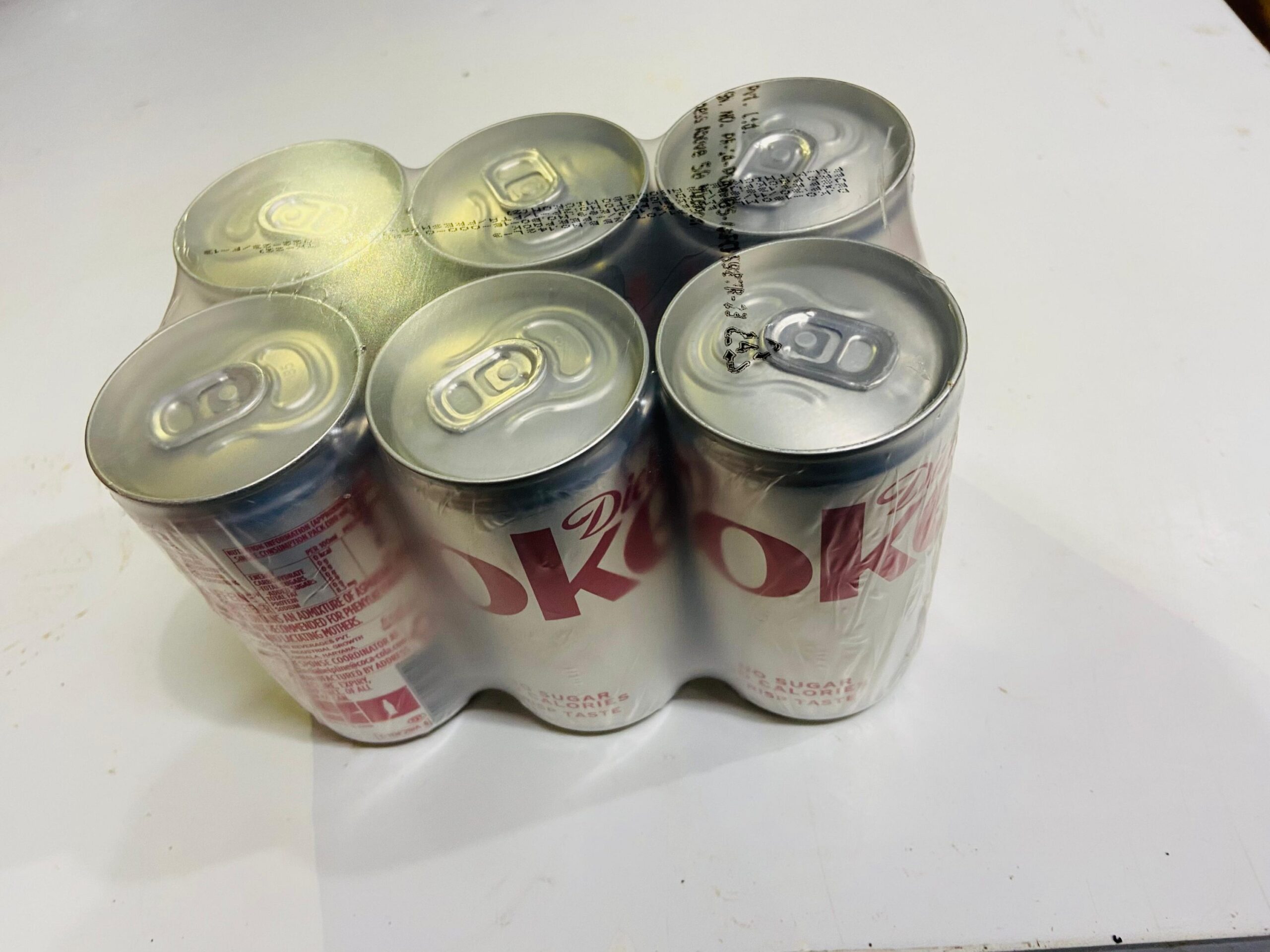 2025/08/1000028400-scaled.jpg Pack of 6 Diet Coke mini cans - Image 1